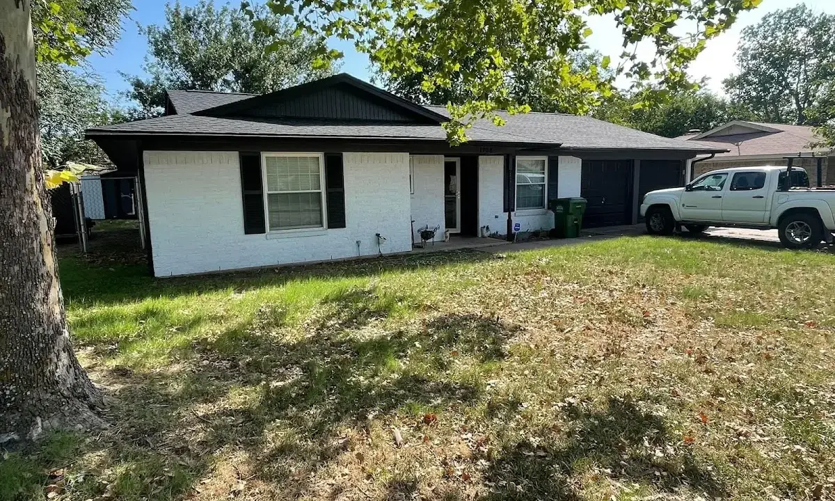 Professional roofing crew working on a residential roof in Larose